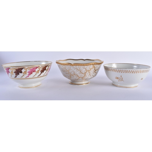 75 - A GROUP OF THREE EARLY 19TH CENTURY WORCESTER SLOP BOWLS including a gilt seaweed bowl. 17 cm diamet... 