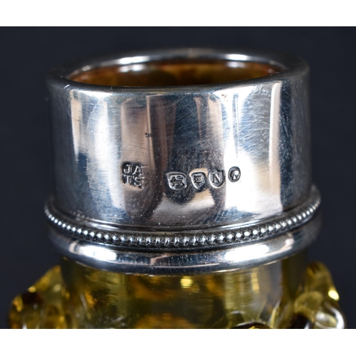 84 - A VICTORIAN SILVER MOUNTED SMOKEY AMBER GLASS DECANTER. 18 cm x 14 cm.