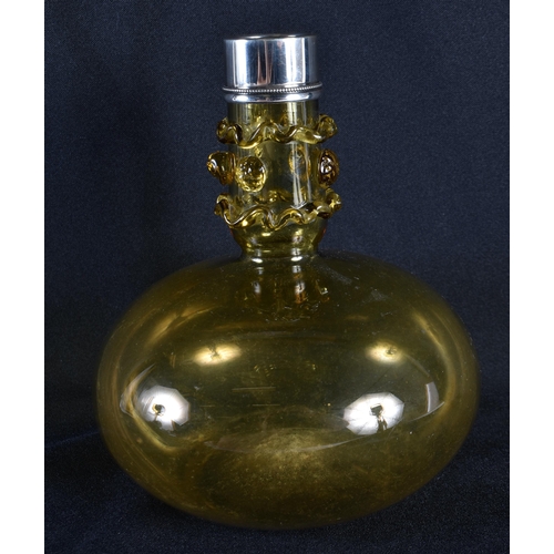 84 - A VICTORIAN SILVER MOUNTED SMOKEY AMBER GLASS DECANTER. 18 cm x 14 cm.