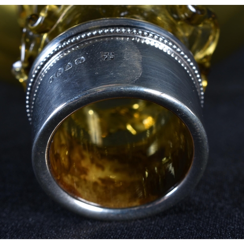 84 - A VICTORIAN SILVER MOUNTED SMOKEY AMBER GLASS DECANTER. 18 cm x 14 cm.