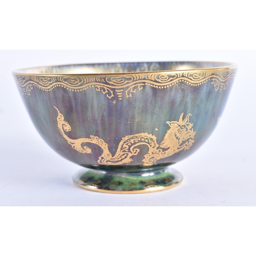 86 - A WEDGWOOD GREEN LUSTRE CIRCULAR DRAGON BOWL. 9.5cm diameter.