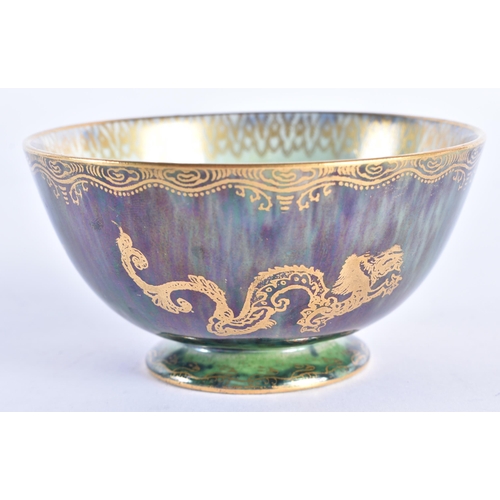 86 - A WEDGWOOD GREEN LUSTRE CIRCULAR DRAGON BOWL. 9.5cm diameter.