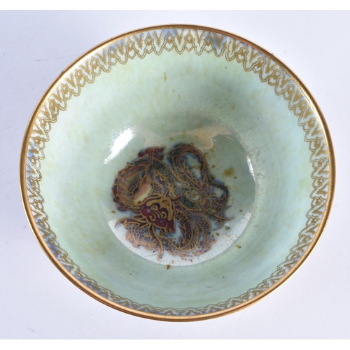 86 - A WEDGWOOD GREEN LUSTRE CIRCULAR DRAGON BOWL. 9.5cm diameter.