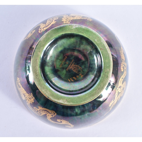 86 - A WEDGWOOD GREEN LUSTRE CIRCULAR DRAGON BOWL. 9.5cm diameter.