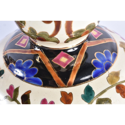 95 - A PAIR OF 19TH CENTURY CONTINENTAL POTTERY GOURD VASES in the manner of Zsolnay or Fischer, painted ... 