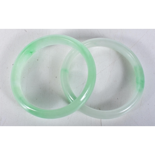 3769 - A pair of jade bangles 6.5cm. (2)`