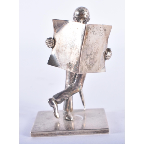 107 - AN ENGLISH SILVER FIGURE OF A MALE modelled reading a newspaper. 80 grams. 8 cm high.