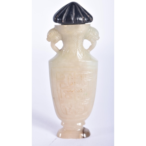 112 - AN EARLY 19TH CENTURY CHINESE CARVED GREENISH WHITE JADE VASE AND COVER Qing, formed with beast hand... 