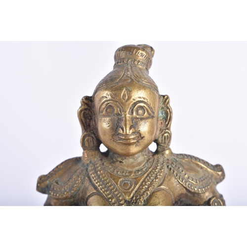 119 - AN 18TH/19TH CENTURY INDIAN BRONZE FIGURE OF A DEITY. 16.5 cm high.