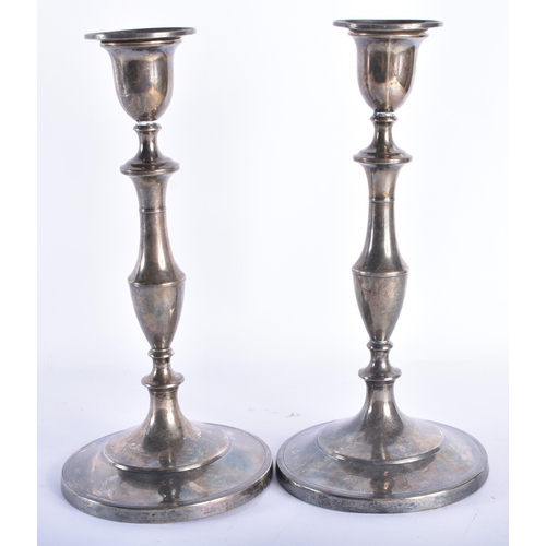 122 - A PAIR OF EARLY 19TH CENTURY ENGLISH SILVER CANDLESTICKS. 1200 grams overall. 27 cm high.