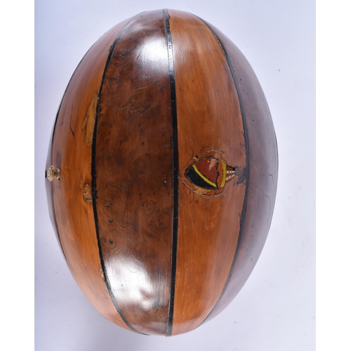 127 - A RARE LATE VICTORIAN/EDWARDIAN NOVELTY RUGBY BALL CASKET with fitted interior, formed from burr wal... 