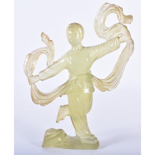 129 - A CHINESE CULTURAL REVOLUTION CARVED JADE FIGURE OF A FEMALE modelled holding aloft her flowing robe... 