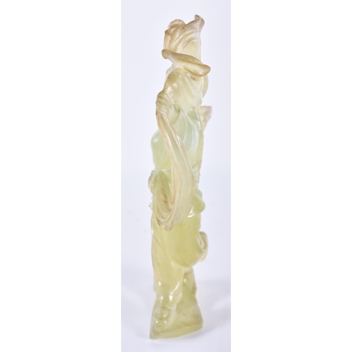 129 - A CHINESE CULTURAL REVOLUTION CARVED JADE FIGURE OF A FEMALE modelled holding aloft her flowing robe... 