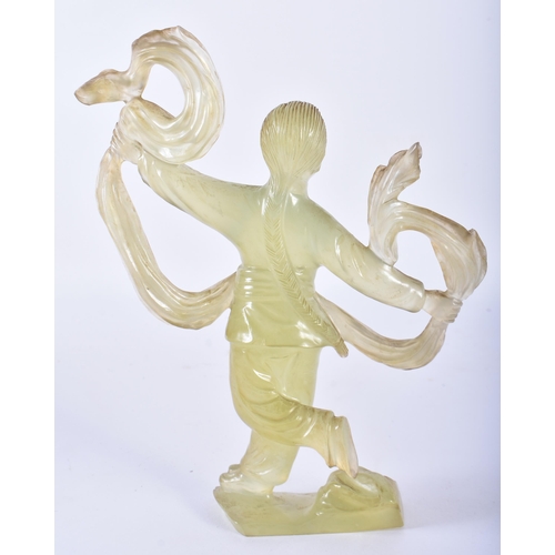 129 - A CHINESE CULTURAL REVOLUTION CARVED JADE FIGURE OF A FEMALE modelled holding aloft her flowing robe... 