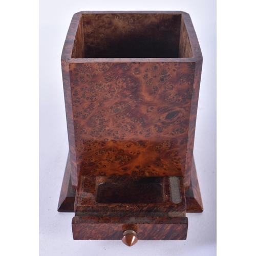 132 - AN EARLY 20TH CENTURY ENGLISH CARVED BURR WOOD SMOKERS COMPENDIUM the pull out drawer revealing a ma... 