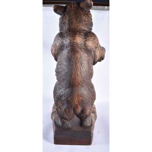 157 - A LARGE 19TH CENTURY BAVARIAN BLACK FOREST BEAR STICK STAND modelled scowling holding a bowed suppor... 