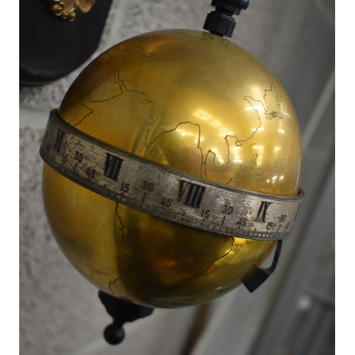 165 - A Thwaites & Reed limited edition gravity timepiece, circa 1972, the suspended brass globe with silv... 