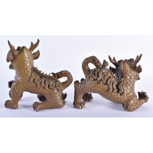 166 - A PAIR OF 19TH CENTURY CHINESE CARVED YIXING STONEWARE BUDDHISTIC LIONS Qing. 18 cm x 20 cm.