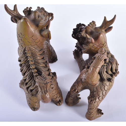 166 - A PAIR OF 19TH CENTURY CHINESE CARVED YIXING STONEWARE BUDDHISTIC LIONS Qing. 18 cm x 20 cm.