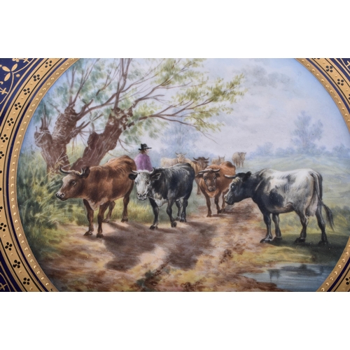 174 - A FINE AND RARE 19TH CENTURY MEISSEN RETICULATED PORCELAIN CABINET PLATE painted with cattle and a f... 