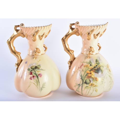 177 - A PAIR OF ROYAL WORCESTER BLUSH IVORY PORCELAIN JUGS painted with dandelions. 19 cm high.