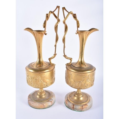 181 - A PAIR OF MID 19TH CENTURY EUROPEAN GILT BRONZE GRAND TOUR EWERS with serpent wrapped handles, decor... 