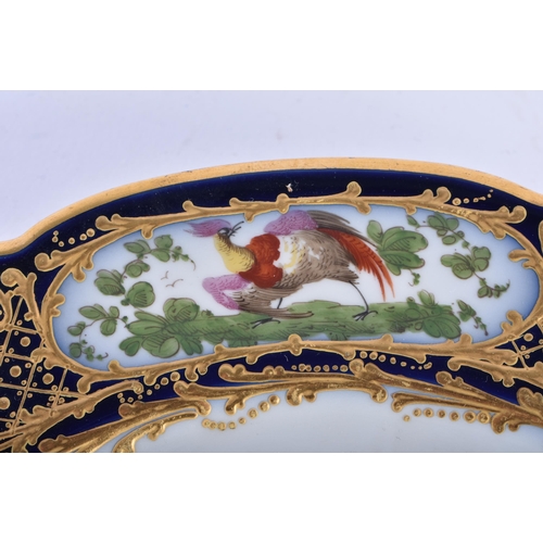 183 - A 19TH CENTURY FRENCH SEVRES PORCELAIN CABINET PLATE painted with an exotic bird within a blue borde... 