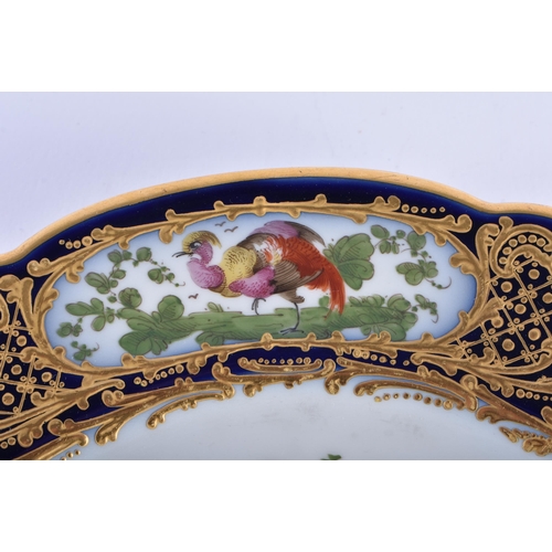 183 - A 19TH CENTURY FRENCH SEVRES PORCELAIN CABINET PLATE painted with an exotic bird within a blue borde... 