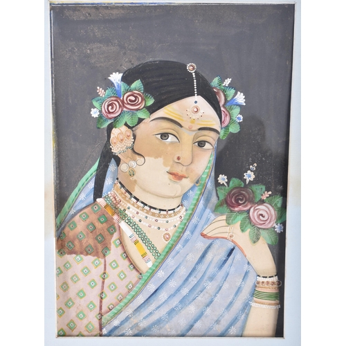 192 - Indian School (19th Century) Oil on paper, Female holding flowers. Image 36 cm x 24 cm.