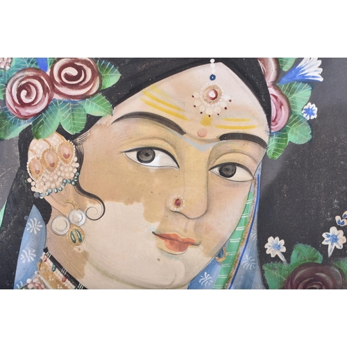 192 - Indian School (19th Century) Oil on paper, Female holding flowers. Image 36 cm x 24 cm.