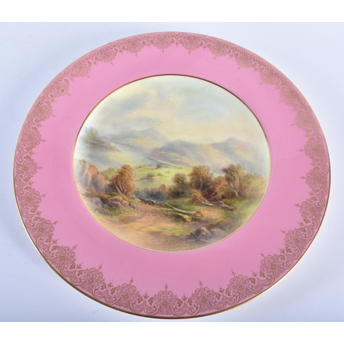 198 - AN UNUSUAL ROYAL WORCESTER PINK GROUND PORCELAIN LANDSCAPE PLATE by James Stinton. 26 cm diameter.