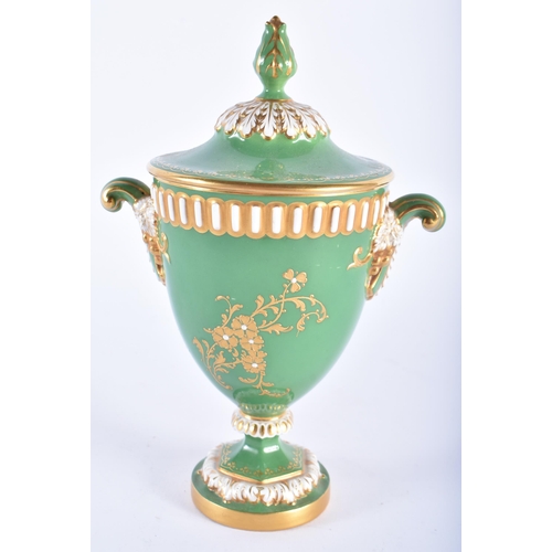 203 - A ROYAL WORCESTER TWIN HANDLED PORCELAIN VASE AND COVER by Harry Stinton. 18 cm x 12 cm.