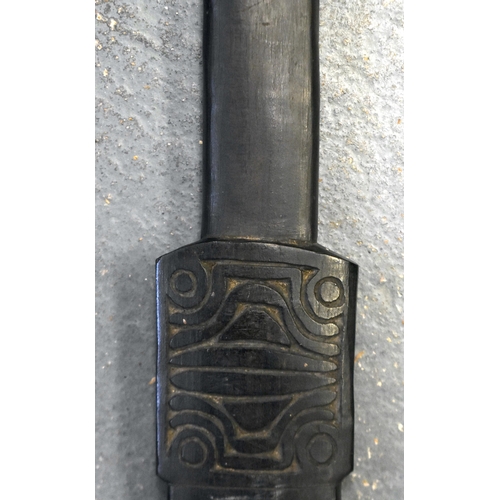 206 - A 19TH CENTURY PAPUA NEW GUINEA TROBRIAND ISLANDS CARVED WOOD SWORD CLUB. 82 cm long.  BUYERS ARE AD... 