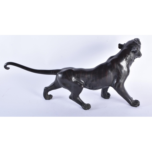 211 - A LARGE 19TH CENTURY JAPANESE MEIJI PERIOD BRONZE OKIMONO modelled as a tiger. 52 cm long.