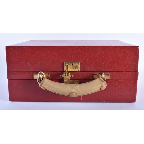 213 - A LOVELY ANTIQUE RED MOROCCAN LEATHER TRAVELLING CASE with original material cloth. 34 cm x 22 cm.