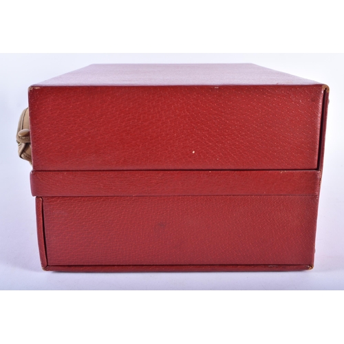 213 - A LOVELY ANTIQUE RED MOROCCAN LEATHER TRAVELLING CASE with original material cloth. 34 cm x 22 cm.