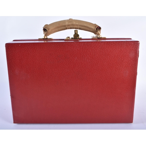 213 - A LOVELY ANTIQUE RED MOROCCAN LEATHER TRAVELLING CASE with original material cloth. 34 cm x 22 cm.