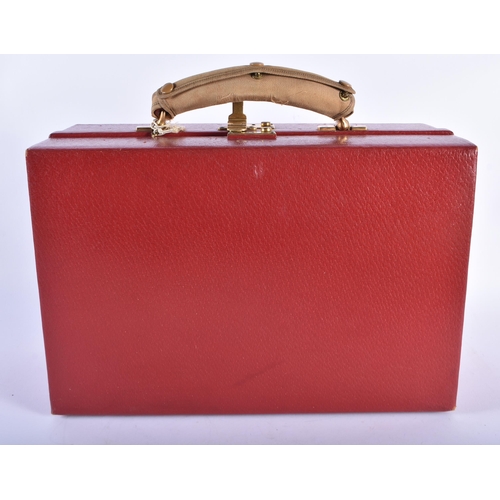 213 - A LOVELY ANTIQUE RED MOROCCAN LEATHER TRAVELLING CASE with original material cloth. 34 cm x 22 cm.