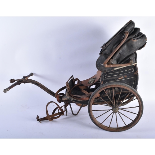 216 - A VICTORIAN LEATHER DOLLS PULL ALONG PRAM. 60 cm x 48 cm.