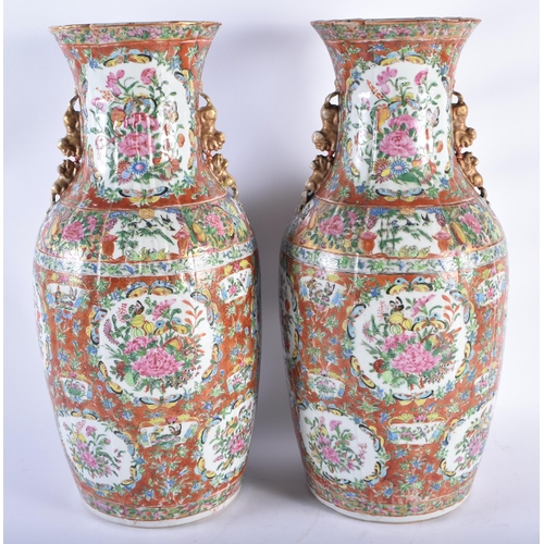 218 - A LARGE PAIR OF 19TH CENTURY CHINESE CORAL GROUND FAMILLE ROSE PORCELAIN STRAITS VASES Qing, painted... 