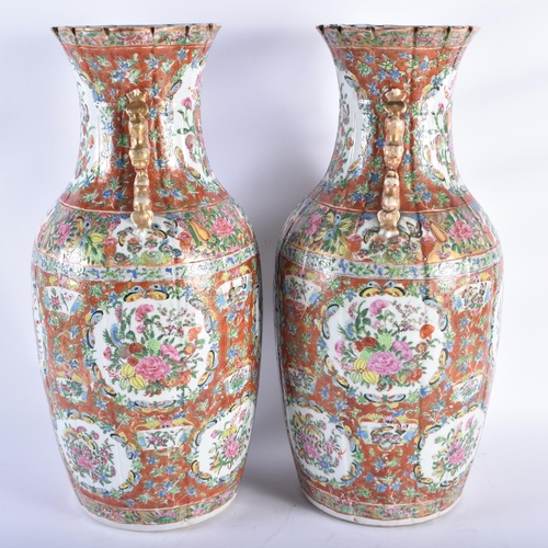 218 - A LARGE PAIR OF 19TH CENTURY CHINESE CORAL GROUND FAMILLE ROSE PORCELAIN STRAITS VASES Qing, painted... 