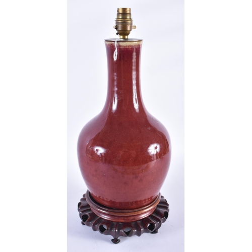 221 - A CHINESE QING DYNASTY SANG DU BOEUF FLAMBE GLAZED LAMP. 42 cm high.