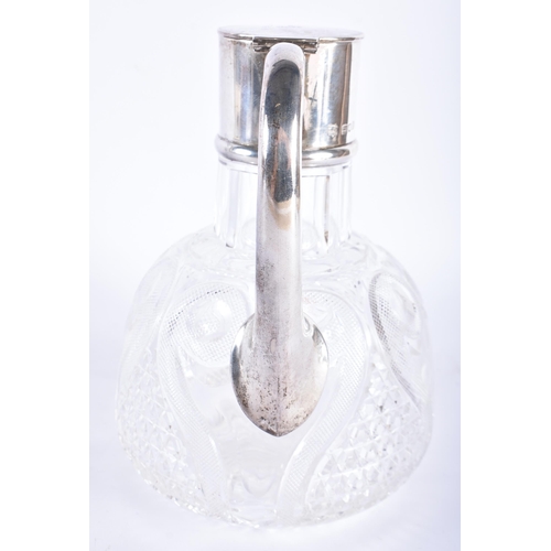 230 - AN ANTIQUE ENGLISH SILVER MOUNTED CUT GLASS DECANTER. 20 cm high.  WE ARE UNABLE TO OFFER IN HOUSE S... 