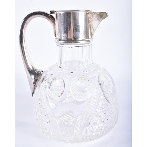 230 - AN ANTIQUE ENGLISH SILVER MOUNTED CUT GLASS DECANTER. 20 cm high.  WE ARE UNABLE TO OFFER IN HOUSE S... 