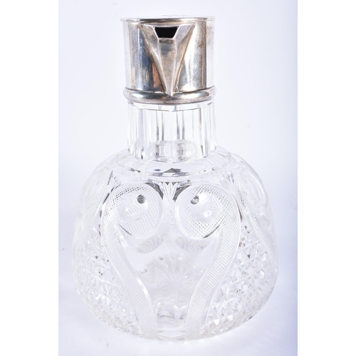 230 - AN ANTIQUE ENGLISH SILVER MOUNTED CUT GLASS DECANTER. 20 cm high.  WE ARE UNABLE TO OFFER IN HOUSE S... 