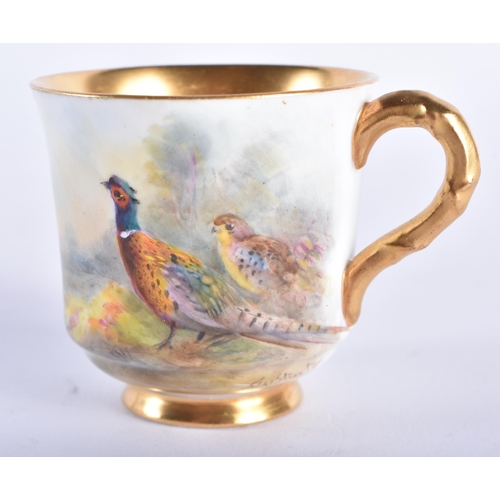 231 - A ROYAL WORCESTER STINTON PORCELAIN GAME BIRD CUP AND SAUCER. 9.5 cm diameter.