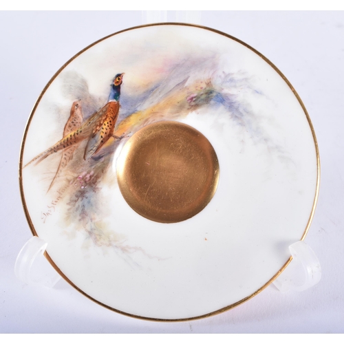 232 - A ROYAL WORCESTER STINTON PORCELAIN GAME BIRD CUP AND SAUCER. 9.5 cm diameter.