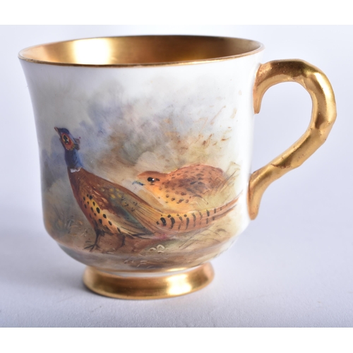 233 - A ROYAL WORCESTER STINTON PORCELAIN GAME BIRD CUP AND SAUCER. 9.5 cm diameter.