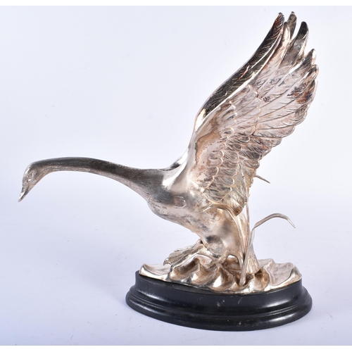 253 - A SPANISH SILVER FIGURE OF A BIRD. 483 grams inc base. 23 cm x 22 cm.