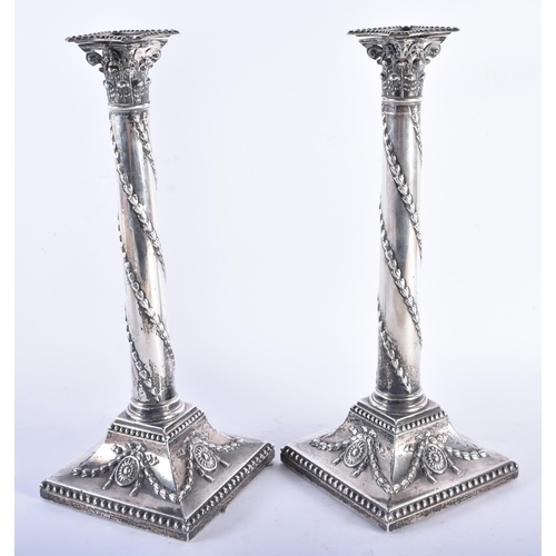 254 - A PAIR OF GEORGE III SILVER CANDLESTICKS by Robert Makepeace & Richard Carter. London 1772. 1897 gra... 